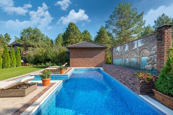 What factors should be considered when selecting a pool slide for a UK home?